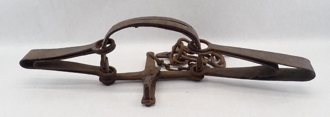 metal spring-loaded trap on a white background