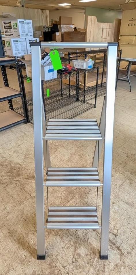Empty metal utility rack in a bright office/workspace