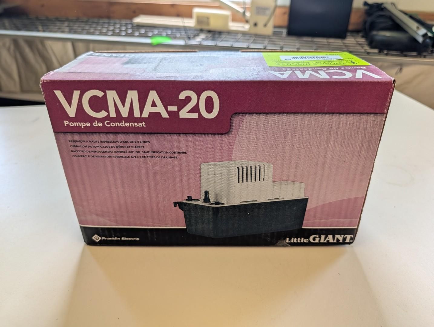 VCMA-20 Little Giant condensate pump box on a desk, maroon and pink packaging with product image