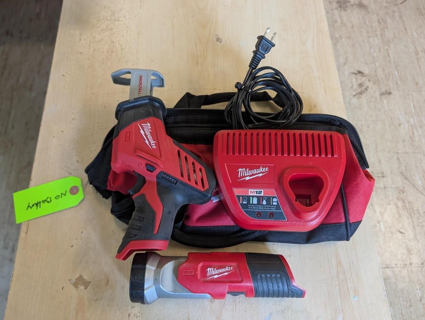 Red Milwaukee cordless ratchet, charger, battery, and red tool bag on a wooden floor.