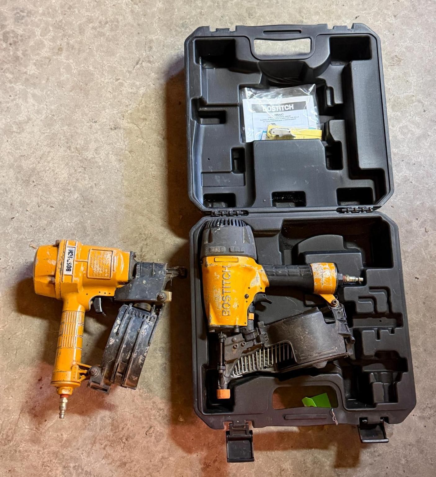 Two yellow power tools and accessories in open black carrying cases on a beige surface