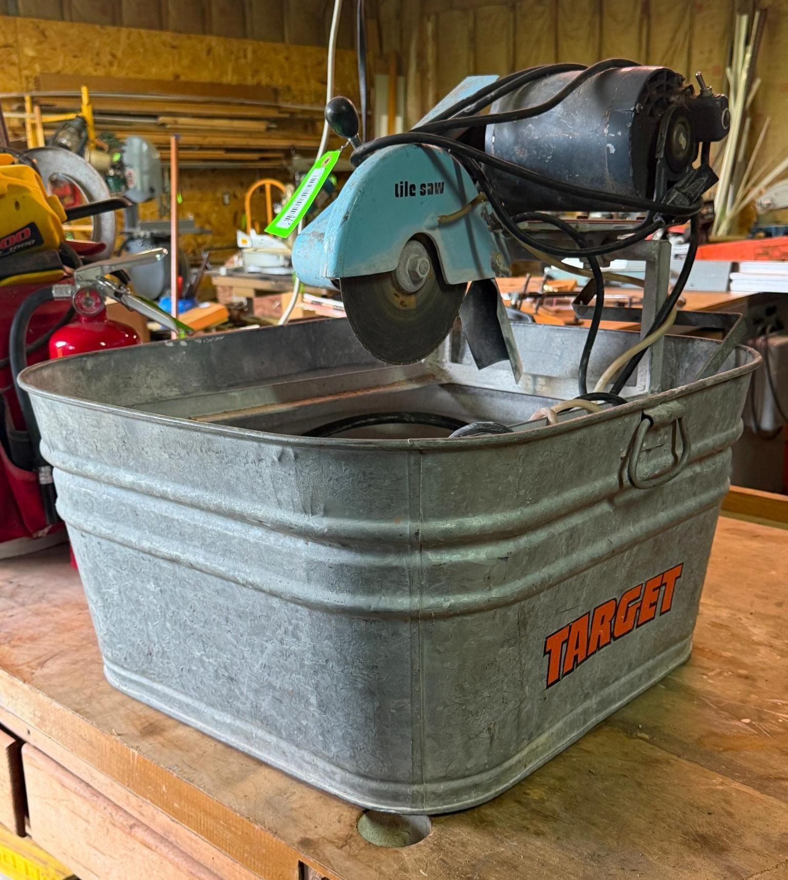 metal tub holding a blue miter saw in a workshop