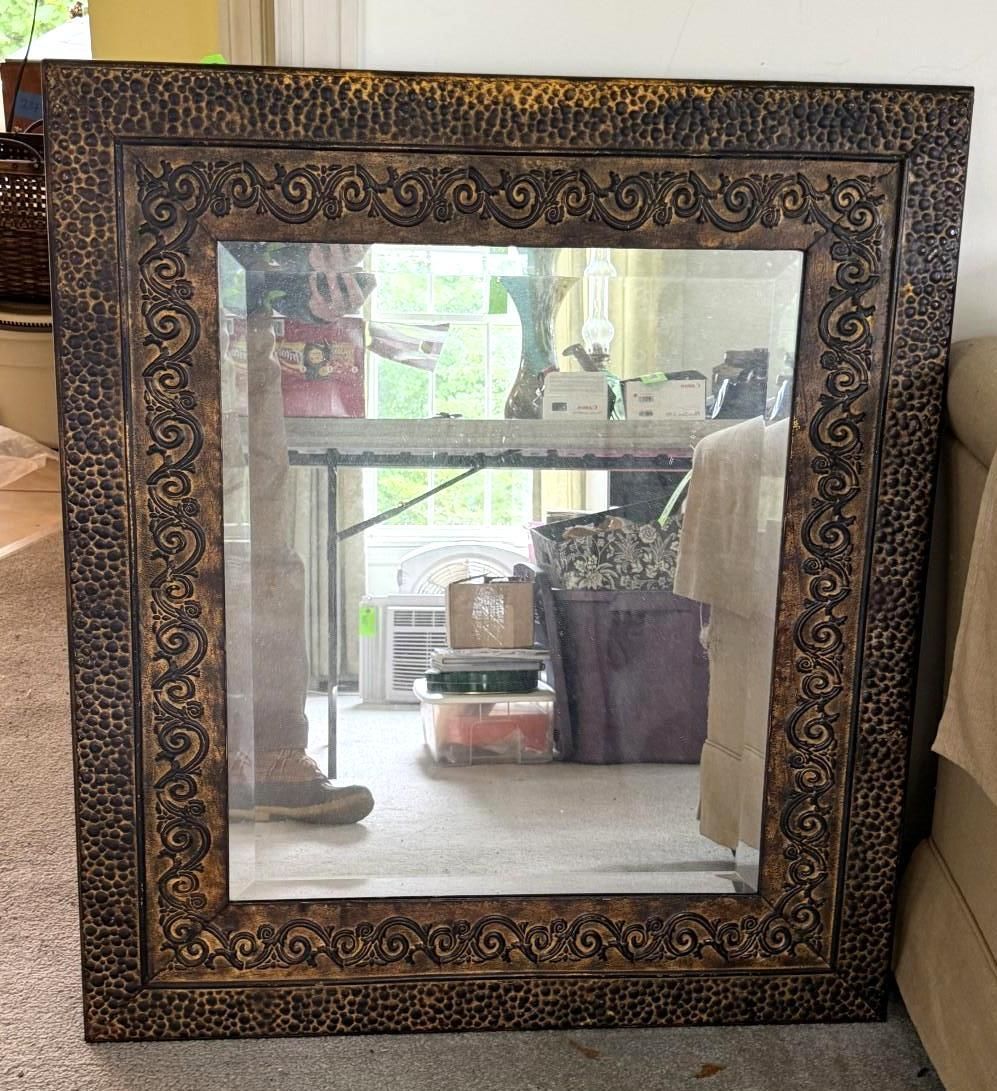 Ornate dark wooden mirror frame
