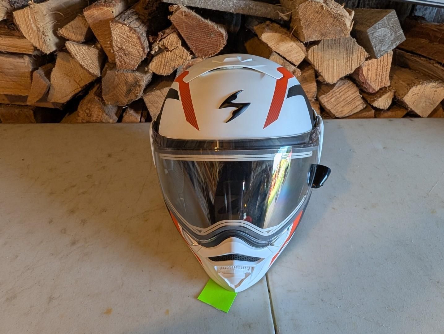 White motorcycle helmet with reflective visor