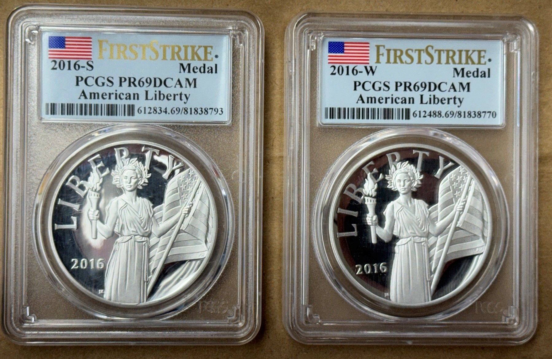 Two graded silver coins in clear PCGS slabs, side by side on a white background.