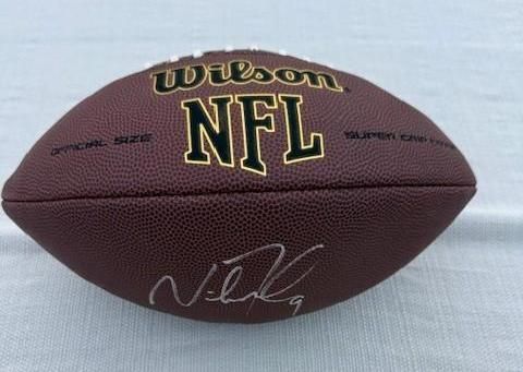 Brown Wilson NFL football with signature.