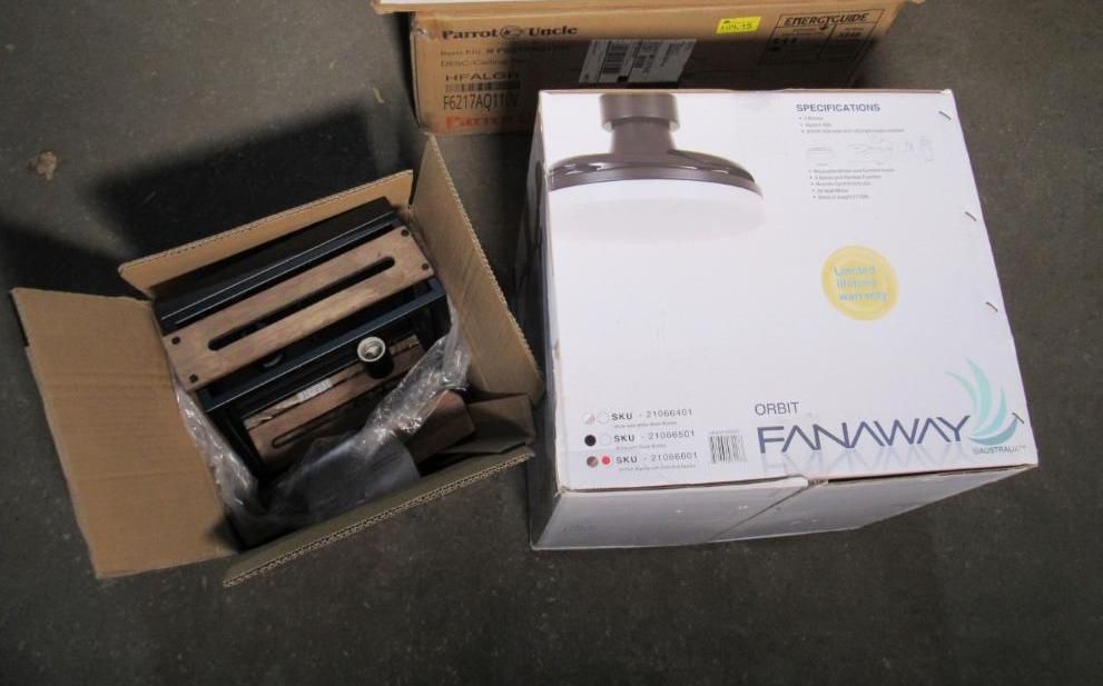 Open box with black ceiling fan parts next to Fanaway ceiling fan box.