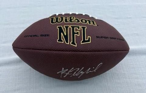 Brown Wilson NFL football with signature.