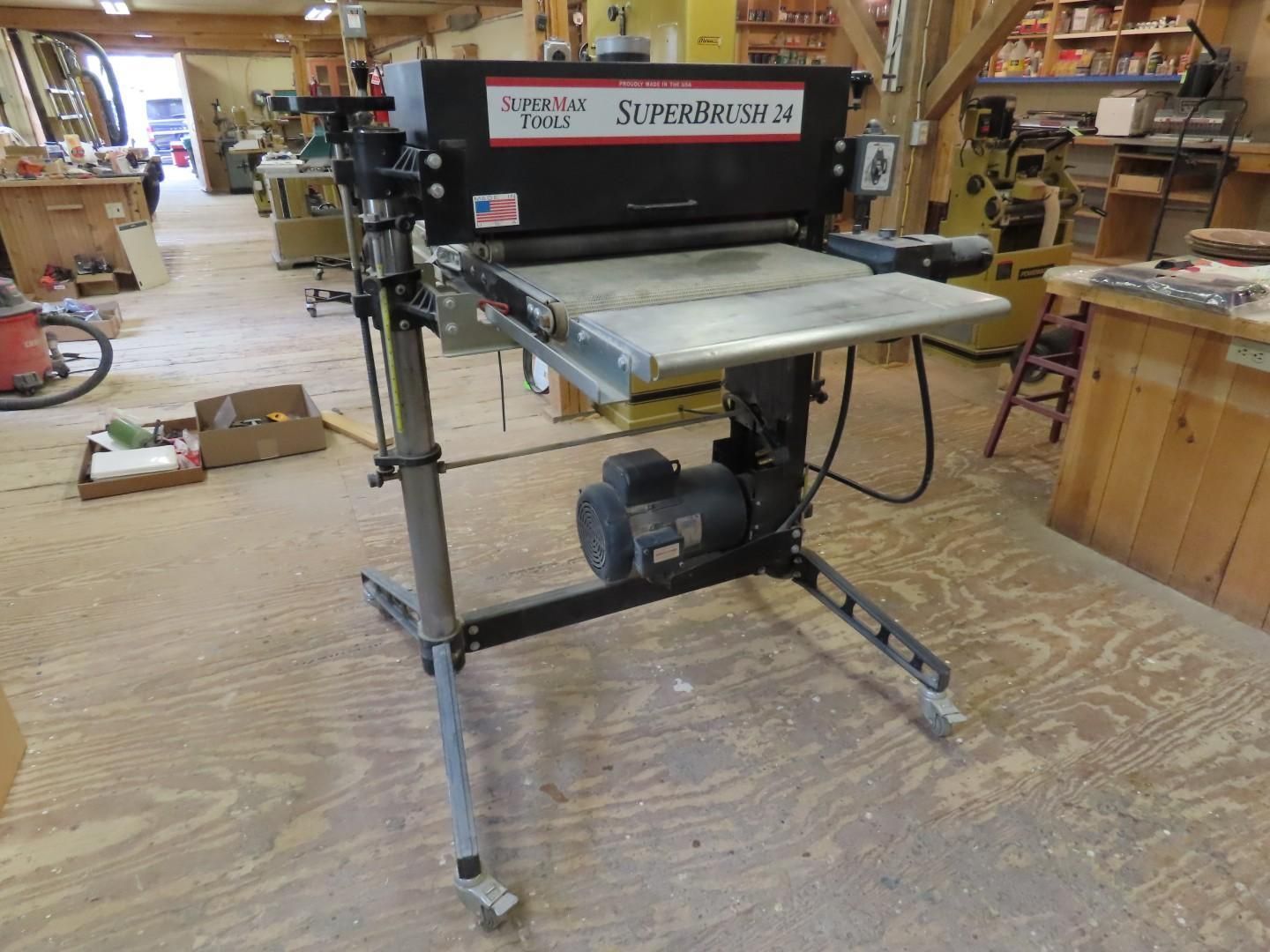 Miter saw on a wheeled stand in a workshop