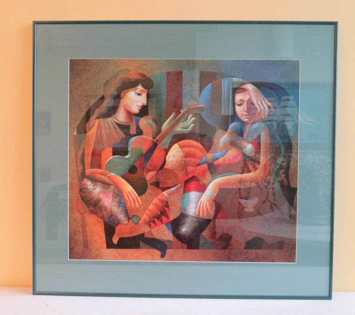 Framed artwork depicting two women, one playing guitar, and a figure between them.