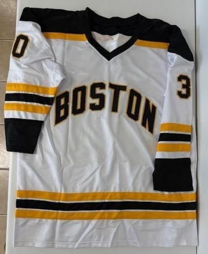 White Boston Bruins hockey jersey with black and gold trim, number 30.