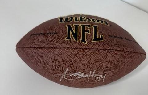 Brown Wilson NFL football with a signature and the number 84.