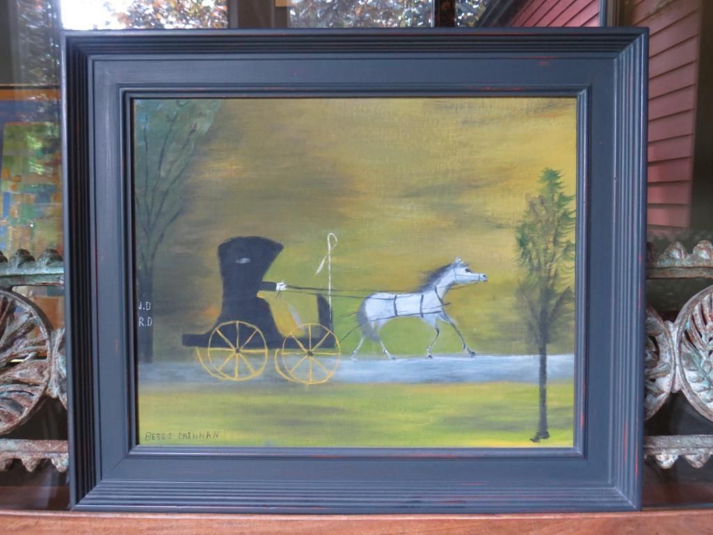 Painting of a black carriage with a white horse on a road, framed in a dark blue frame.