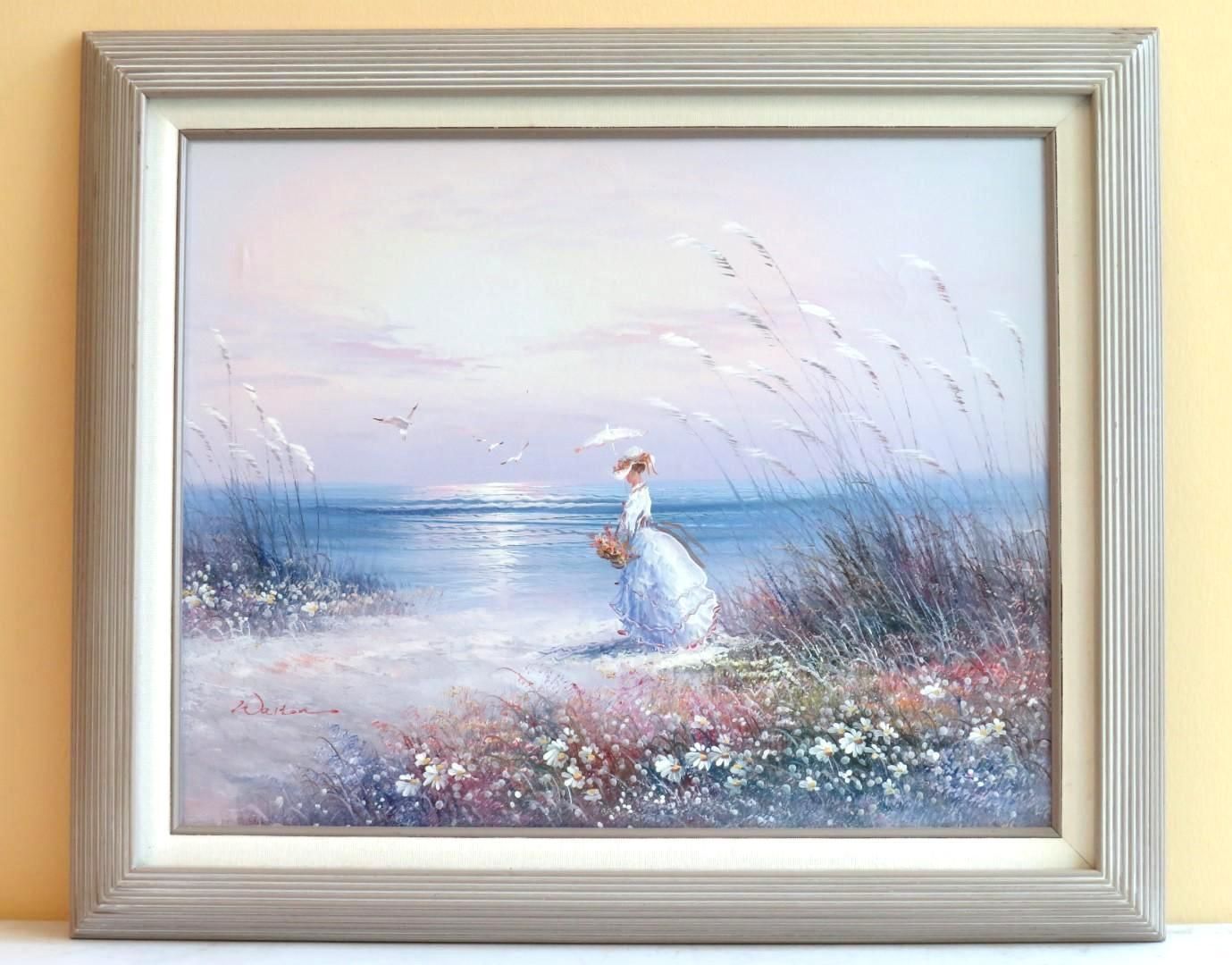 Painting of a woman in white dress on a beach at sunset. Ocean, tall grass, and flowers in the scene.