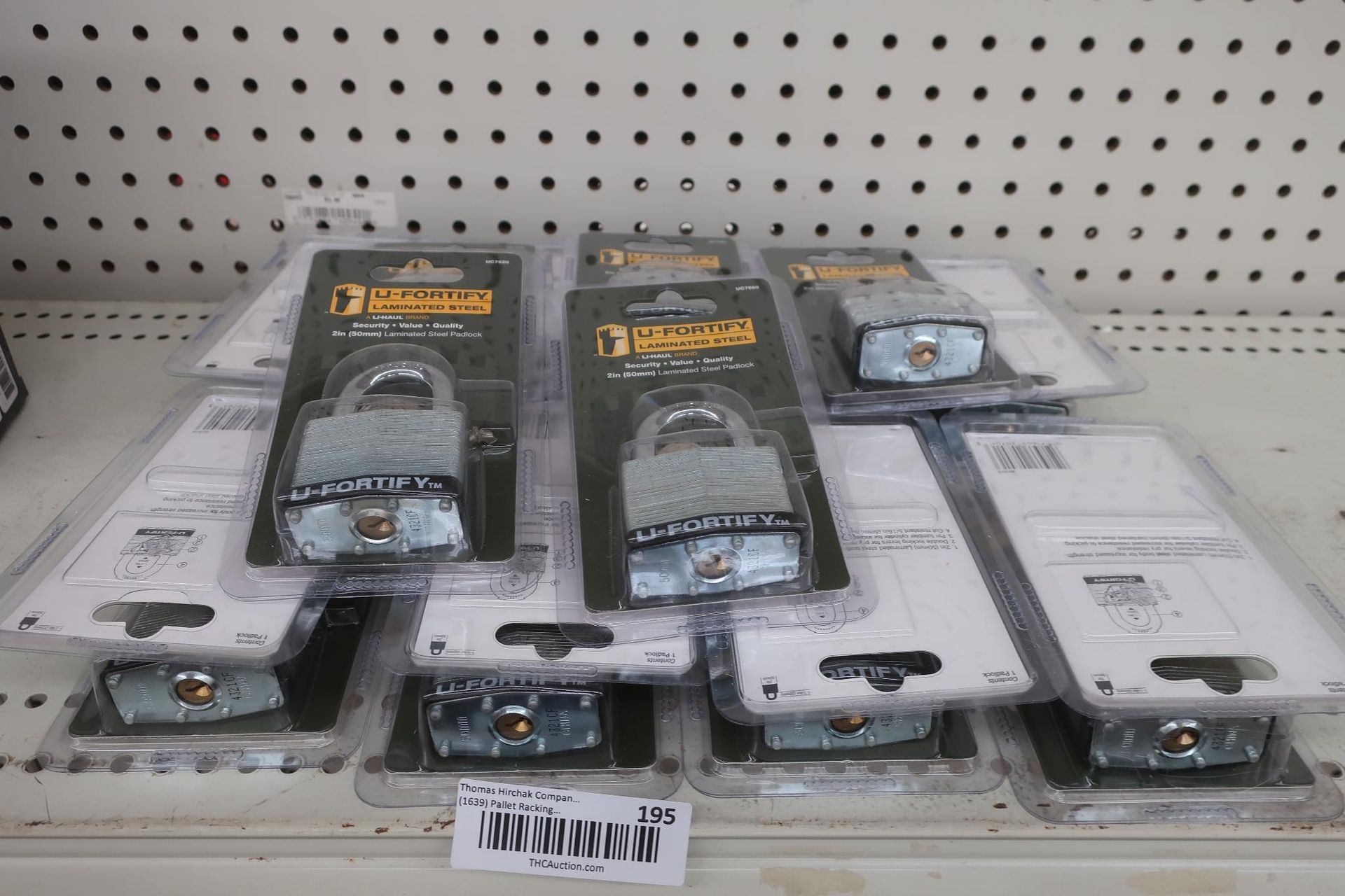 Padlocks on a store shelf, in their packaging.