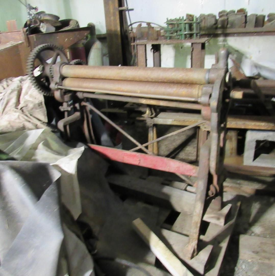 Metal rolling machine.