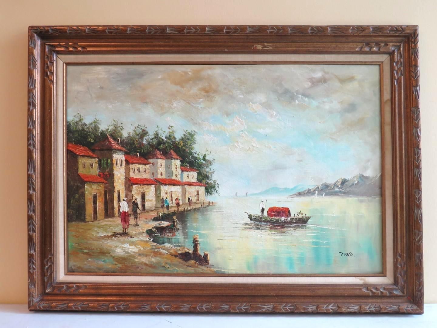 Oil painting of a coastal town scene with buildings, water, boats, and figures along the shore.