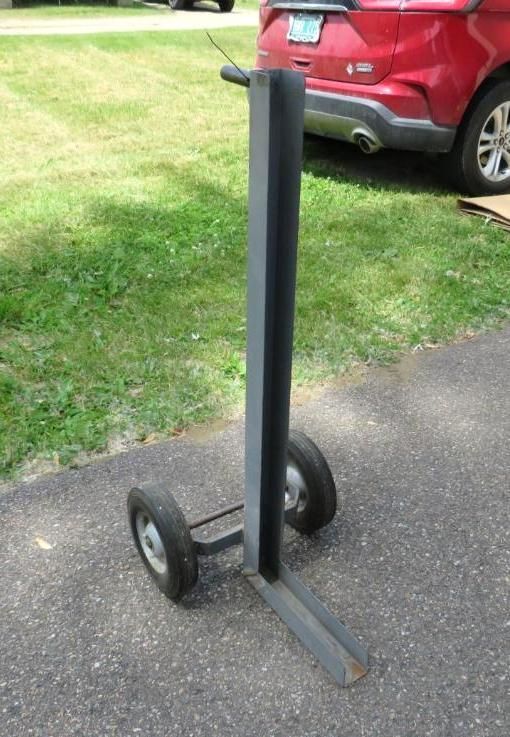 Gray metal hand truck with two wheels.