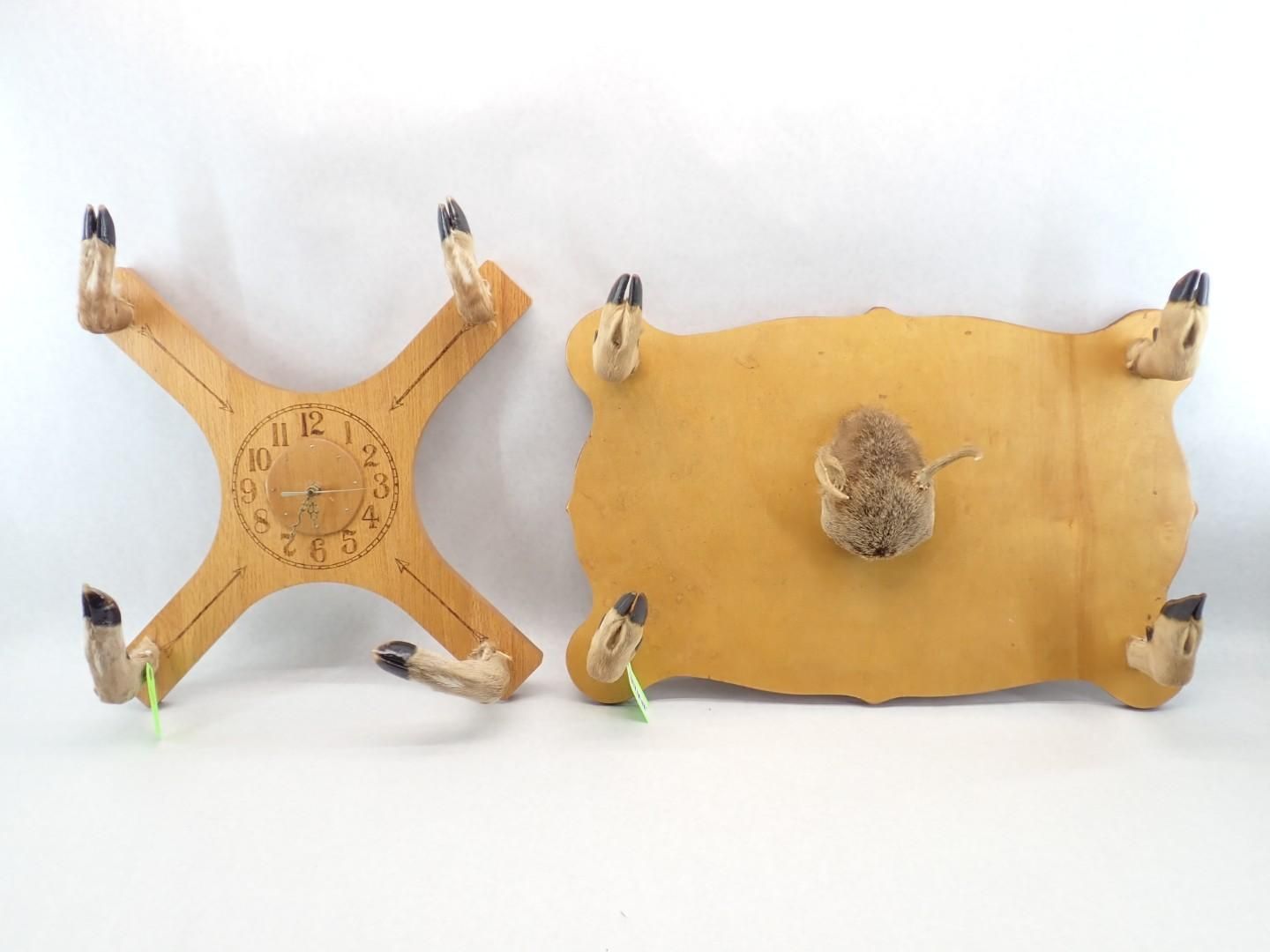 Two small animal-mounted wooden boards, one cross-shaped and one rectangular, on a white background