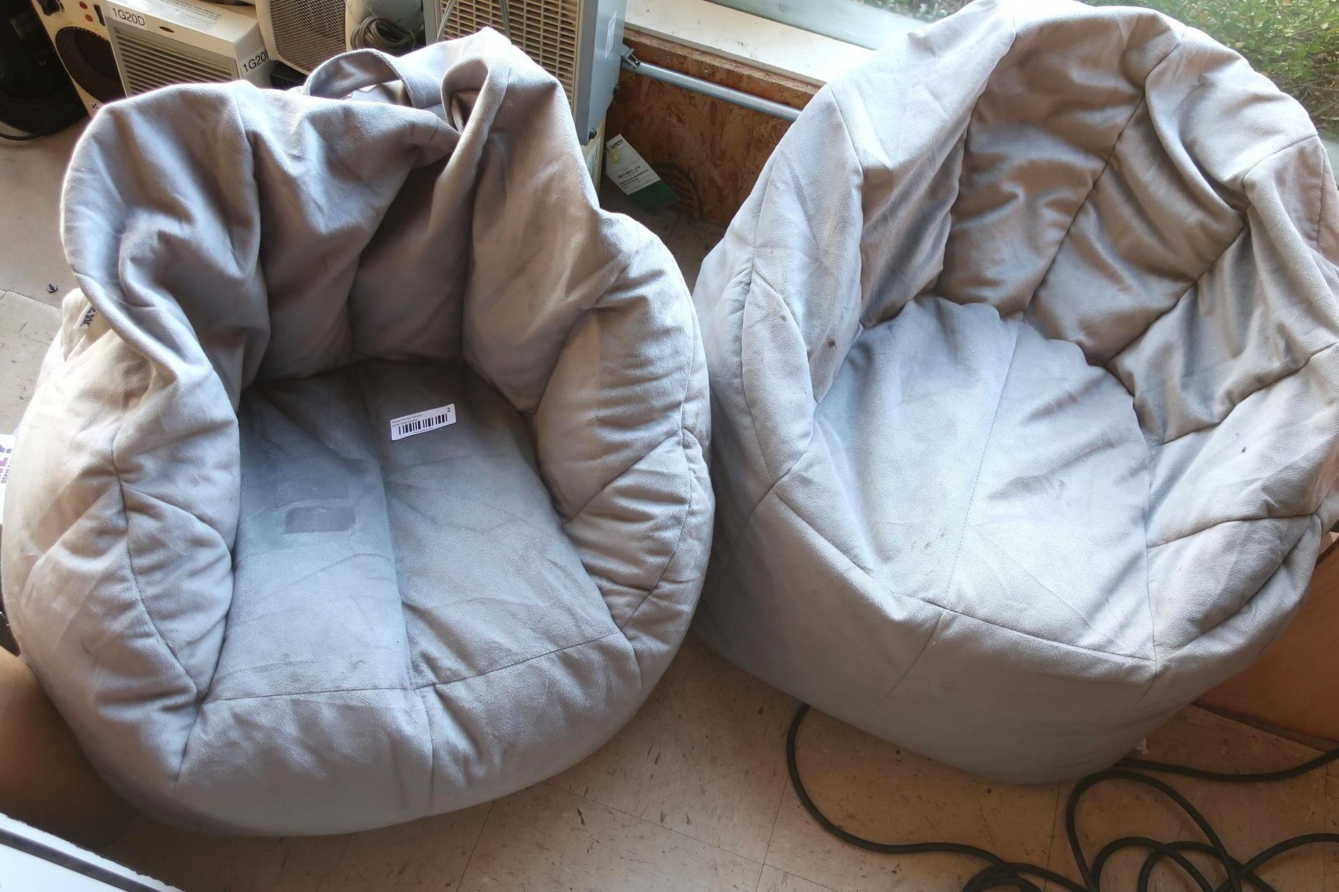 Two light gray beanbag chairs.