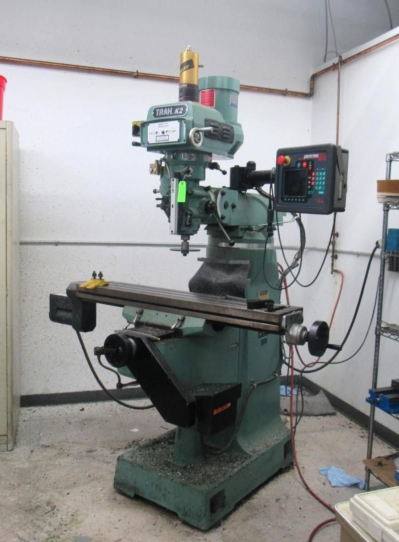 Green Bridgeport Vertical Knee Milling Machine machine in a workshop.