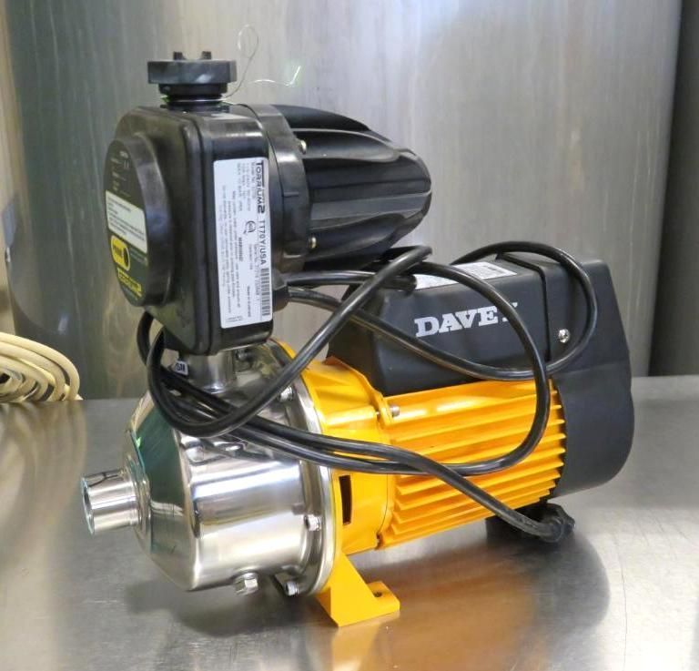 Water pump with yellow and black motor, silver housing, and power cord.