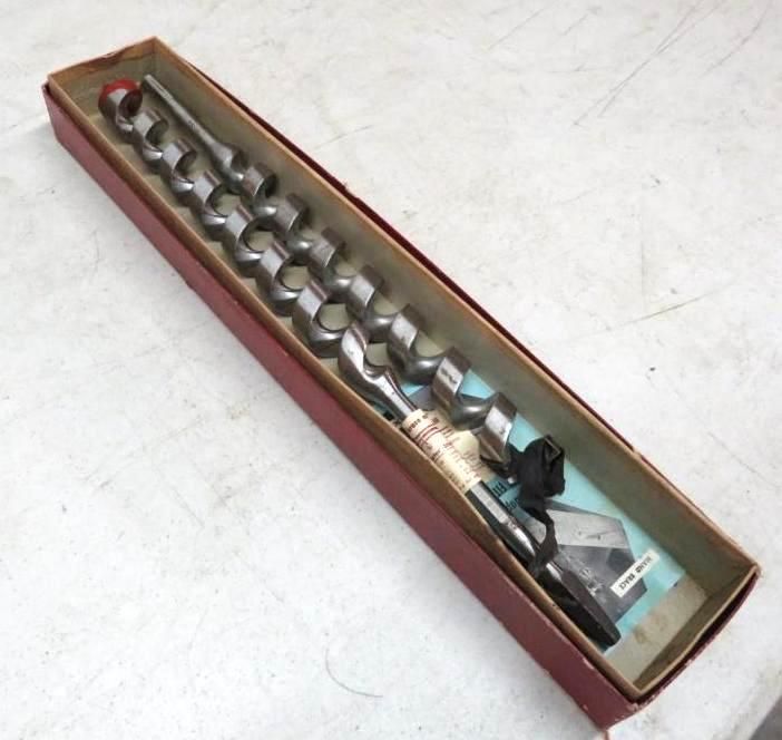 Long drill bits in a box.