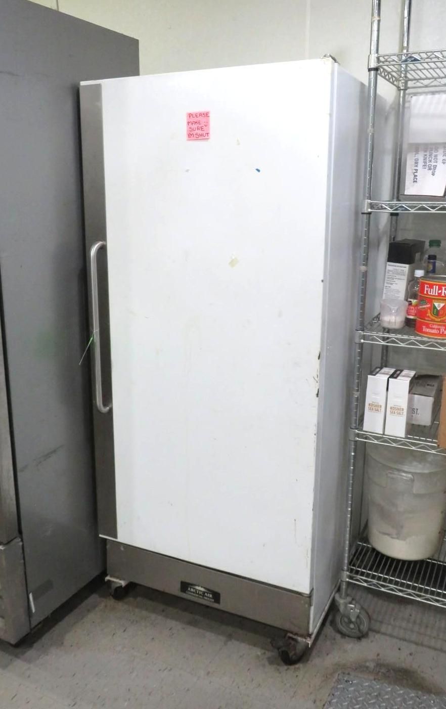 White commercial refrigerator on wheels.