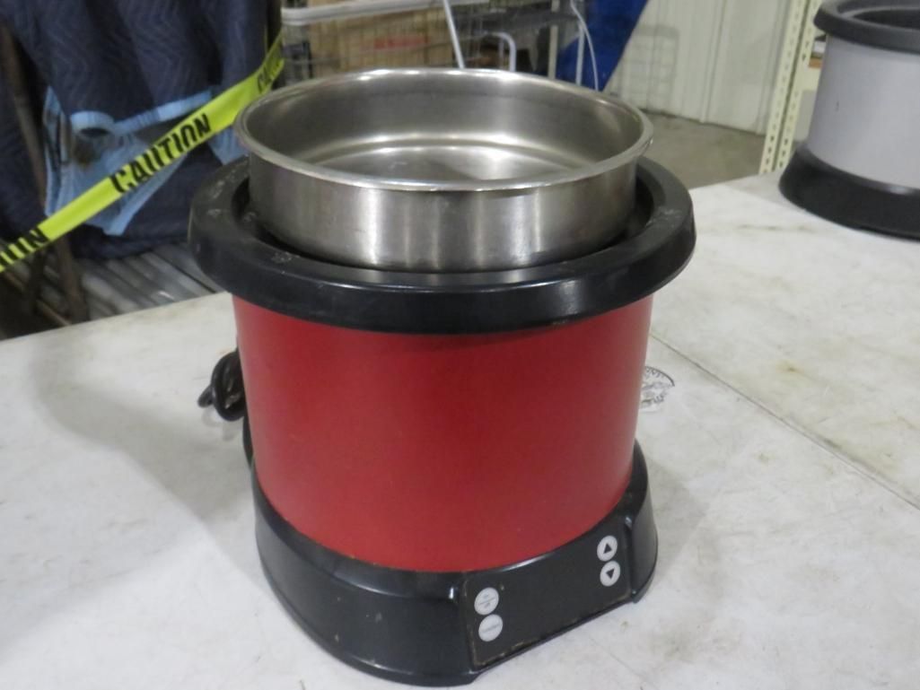 Red industrial sieve with a metal basket, black base, and power cord.