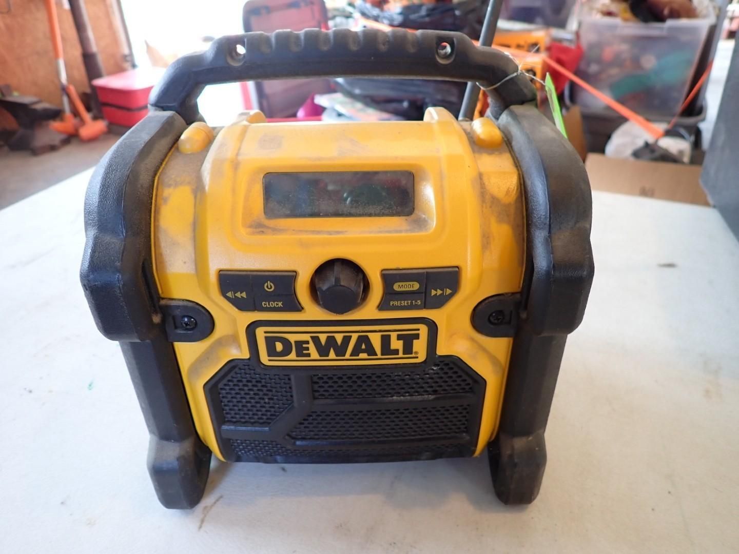 Yellow and black DEWALT portable radio on a table, front view