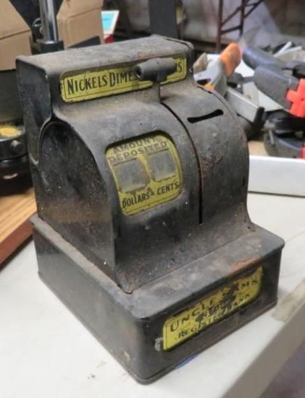 Antique black and yellow toy cash register, 