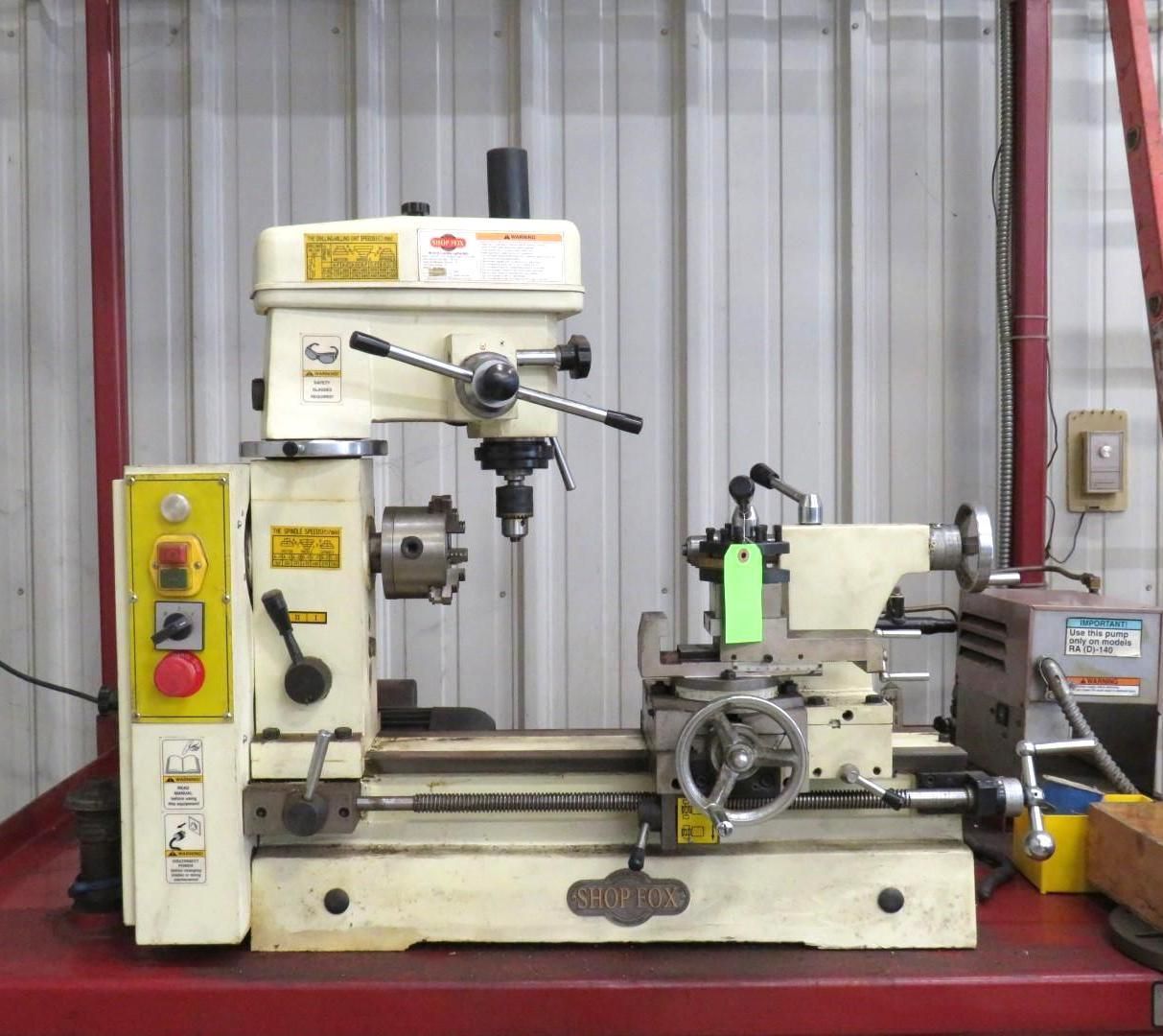 Combined mill-drill and lathe machine in a workshop. It is cream-colored with red and yellow buttons.