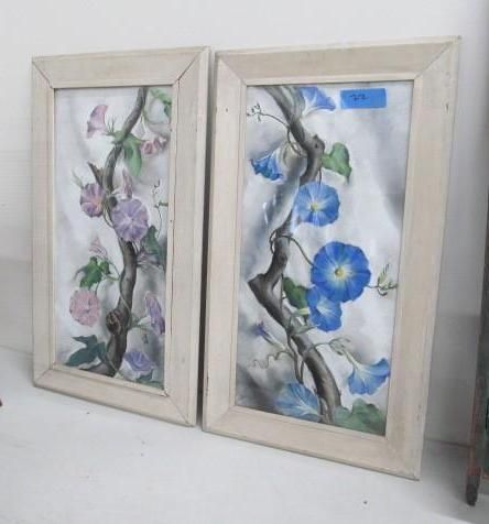 Two framed floral paintings featuring climbing vines with blue, pink, and purple flowers.