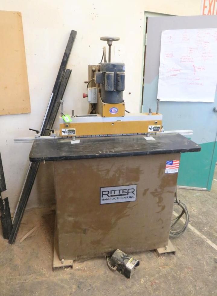 Ritter mortise machine in a workshop, beige and black, with a motor and handles.