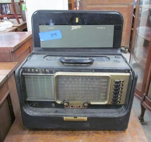 Vintage Zenith stereo radio in black case, open with controls visible.