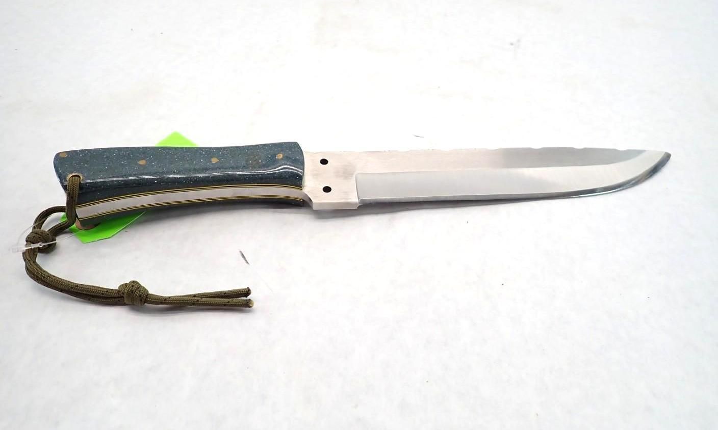 Black-handled fixed-blade knife with a lanyard on a white background