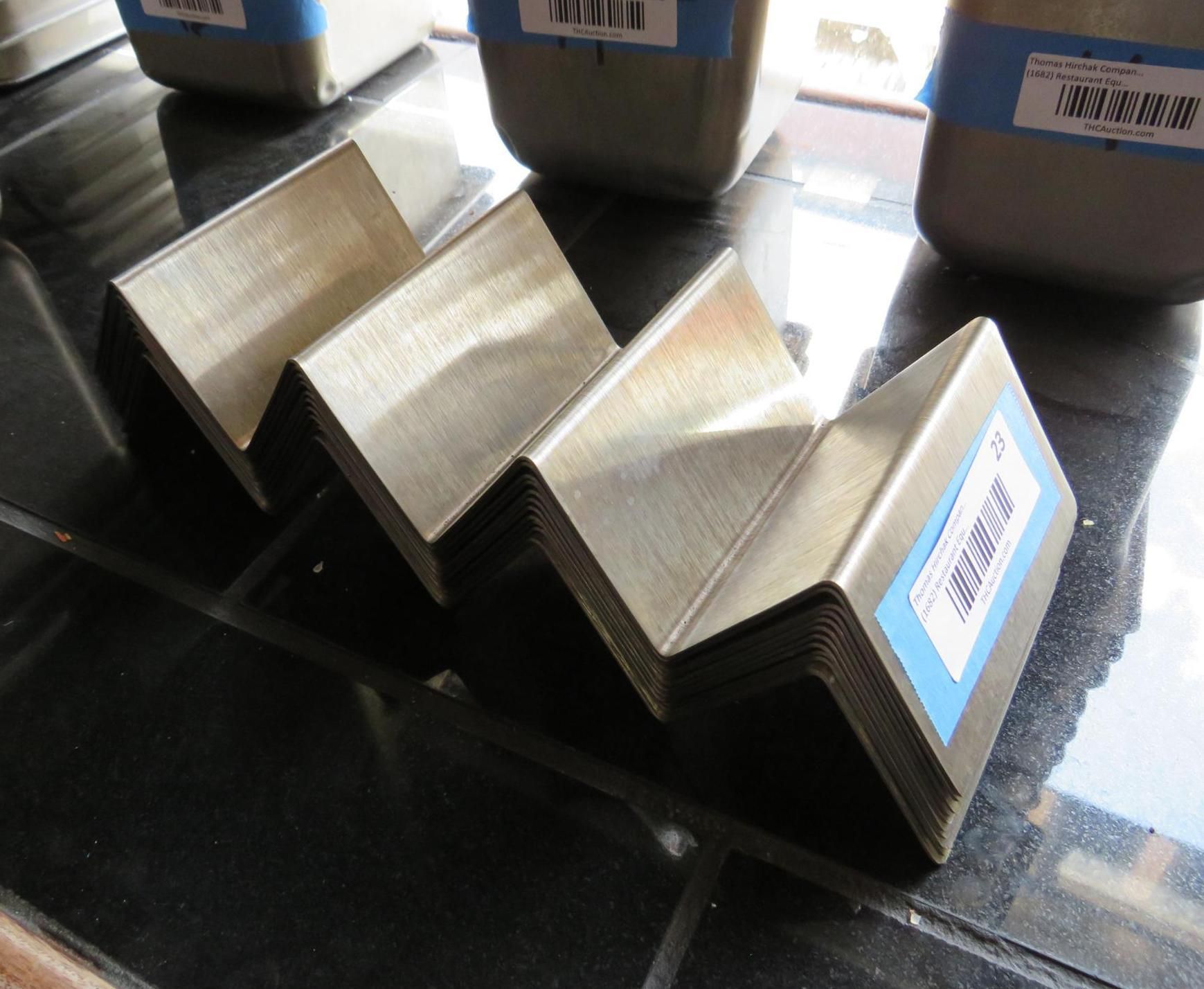 Accordion-folded metal sheets with labels.