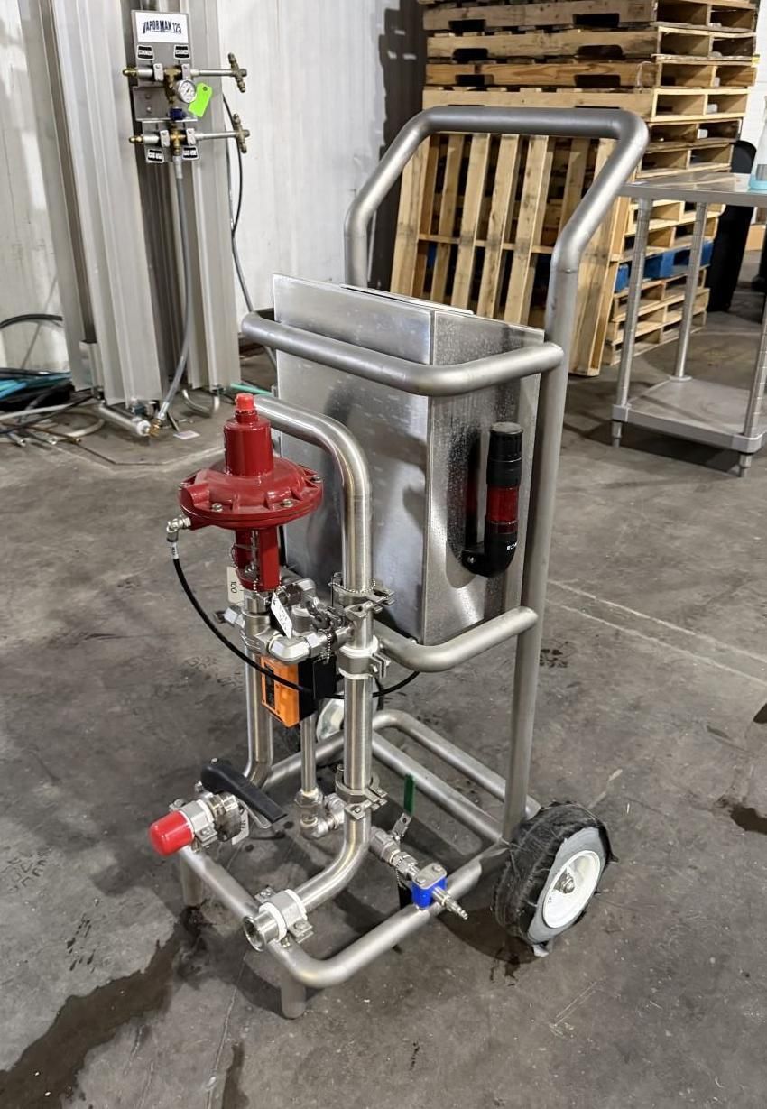 Stainless steel cart with tank and attached red regulator, piping, and valves.