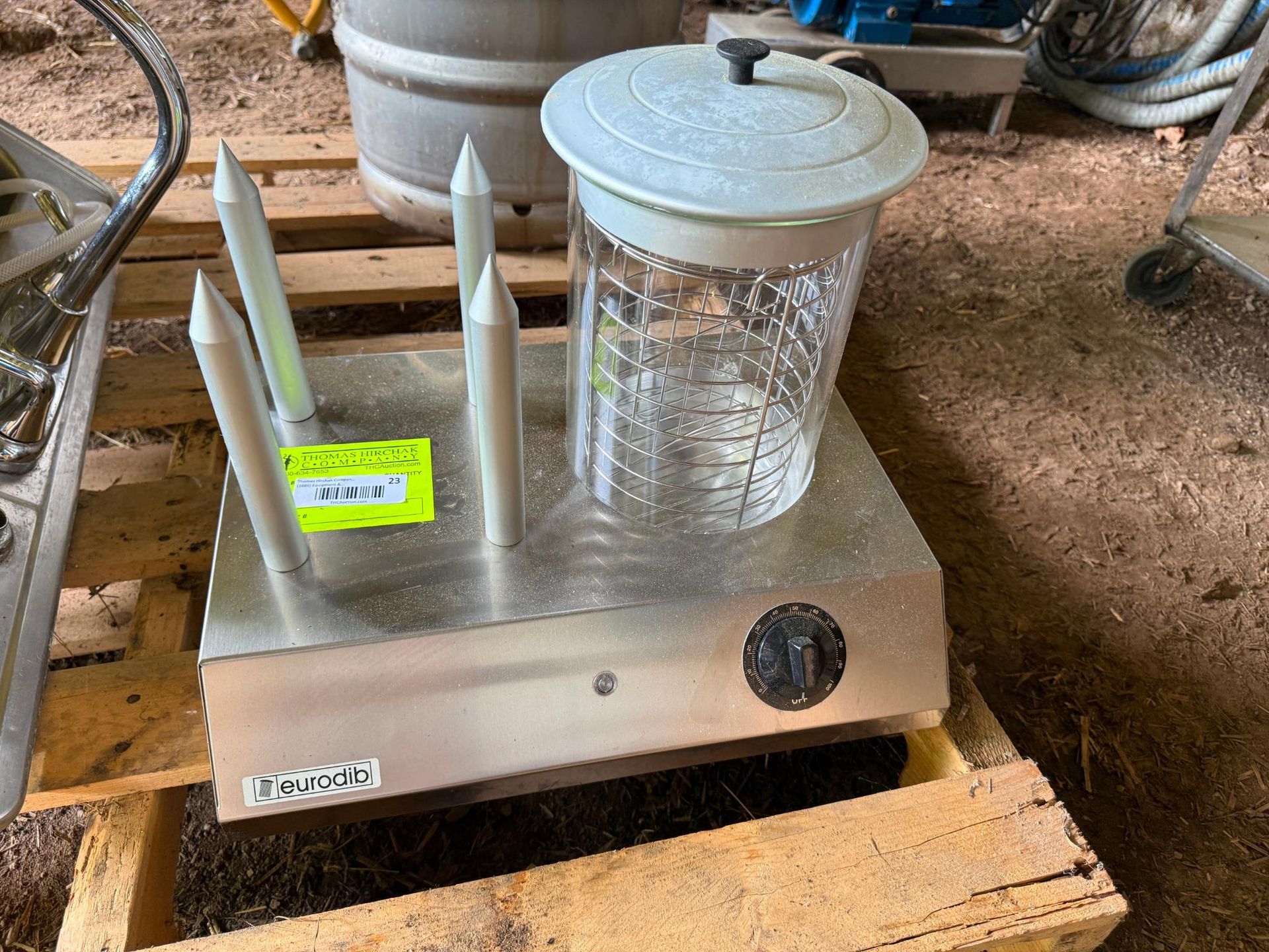 Hot dog warmer with bun warmer, on a wooden pallet.