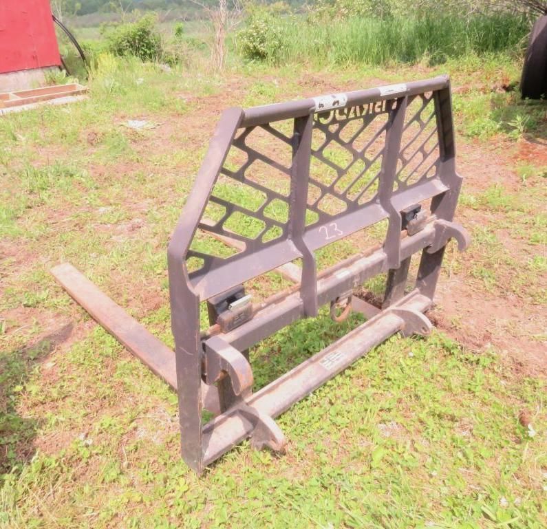 Black farm forklift attachment.