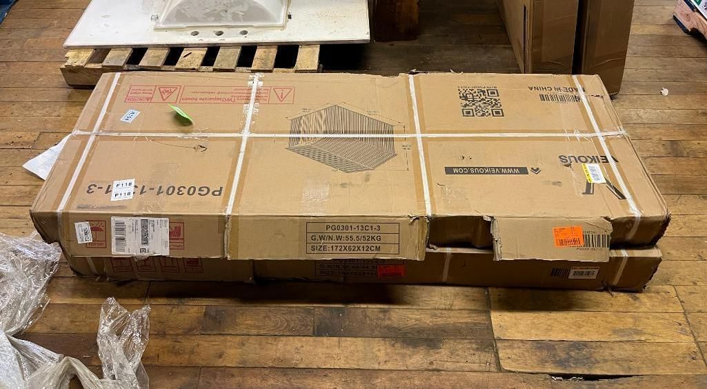 Cardboard box on a wooden pallet, secured with white strapping.