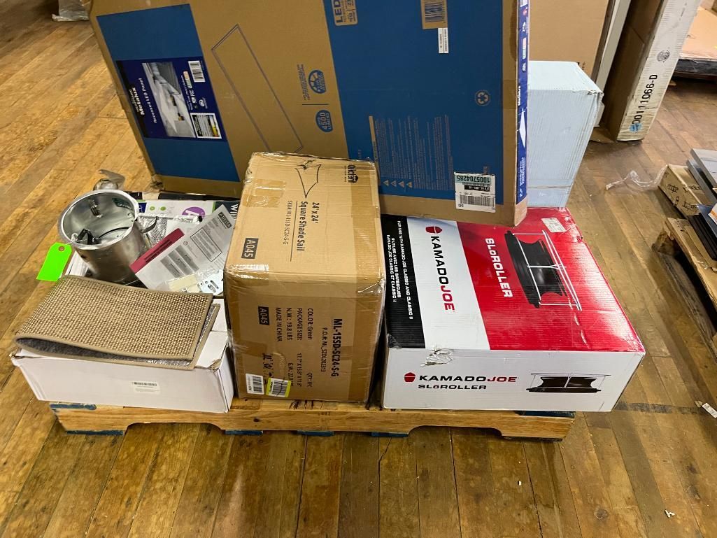 Various cardboard boxes stacked on a wooden pallet.
