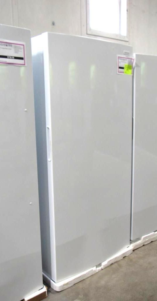 White freezers lined up in a well-lit room.