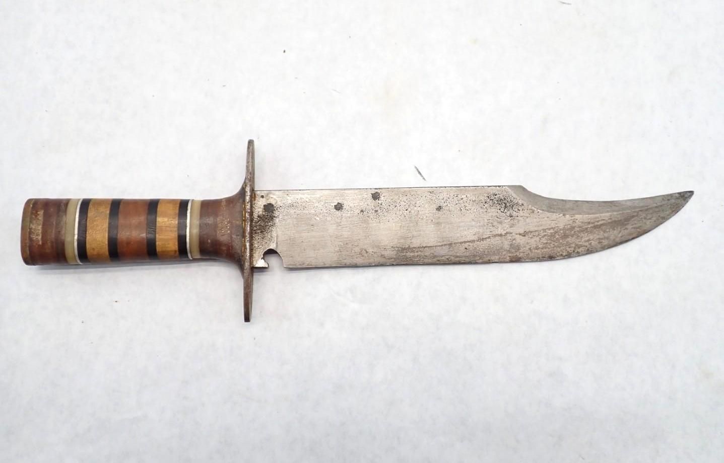 hunting knife with wooden handle on a white background