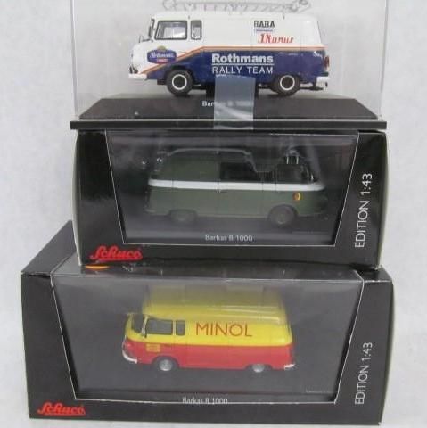Three model vans in boxes, Rothmans, green, and Minol livery.