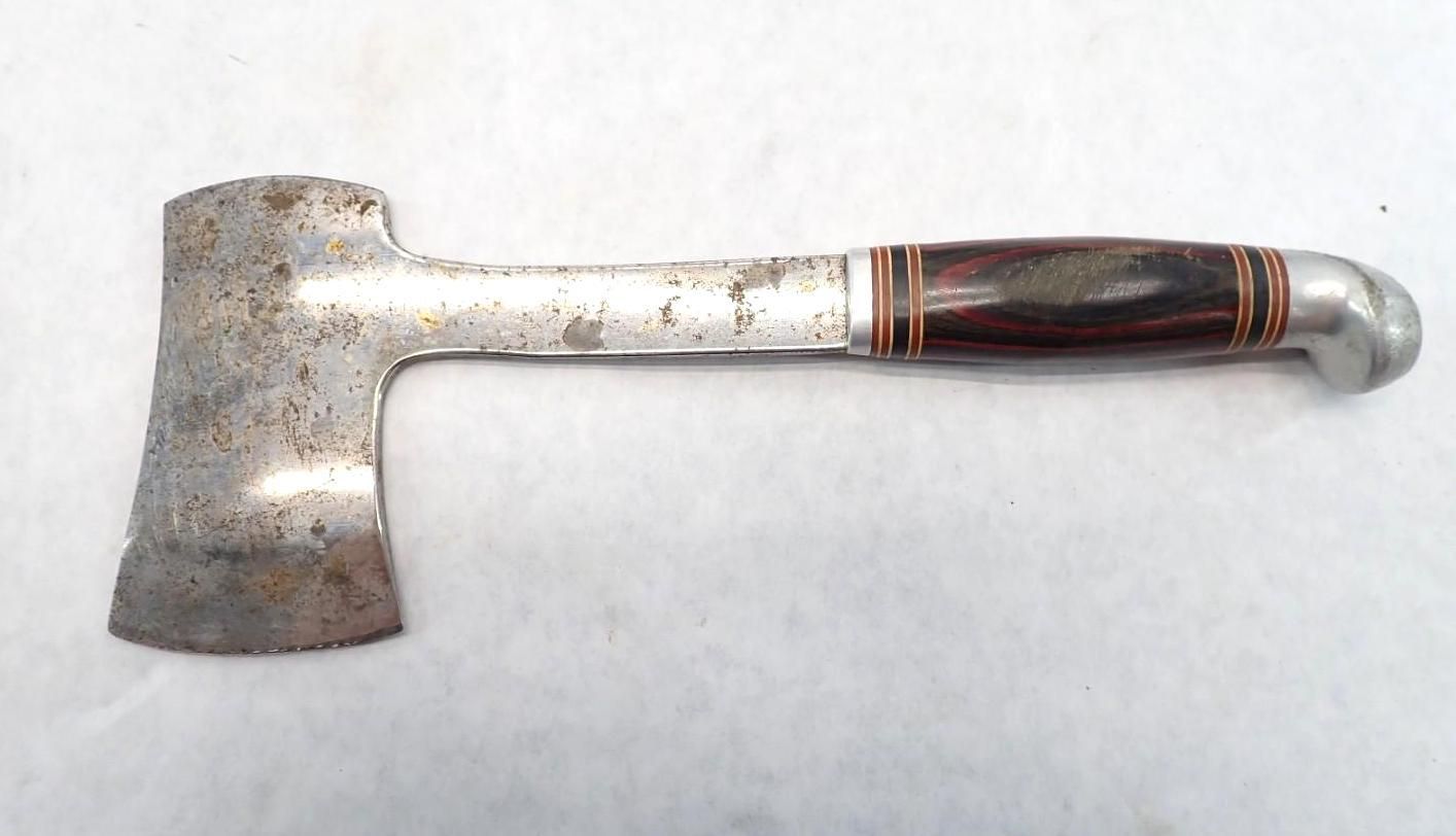 A metal hatchet with a wooden handle and silver end cap on a white background