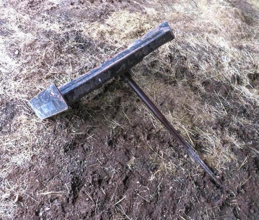 Metal log lifter tool.