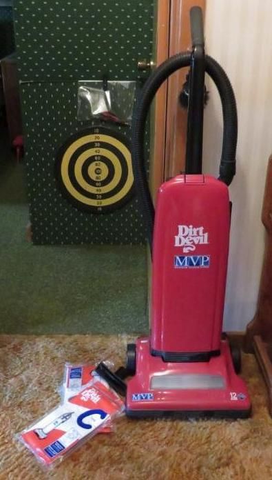 Red Dirt Devil MVP vacuum cleaner and replacement bags.