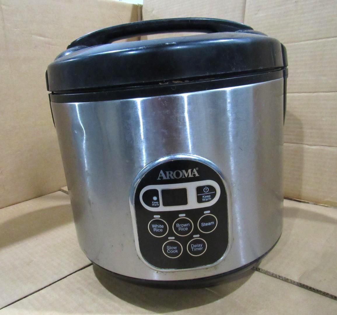 Silver Aroma rice cooker with black lid and control panel.