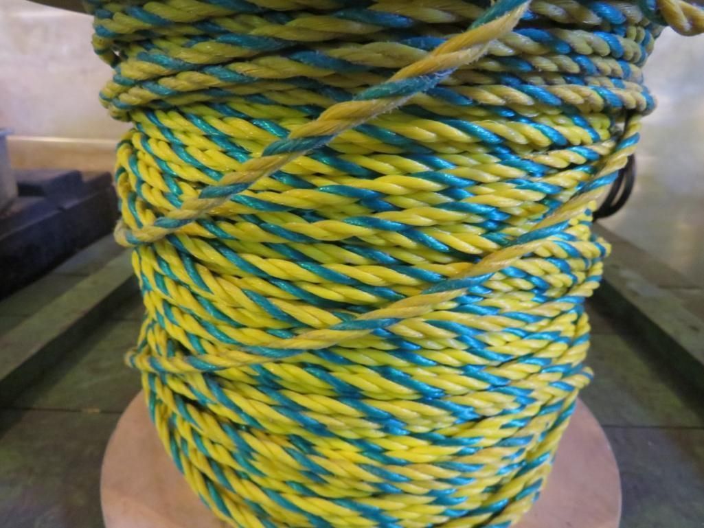 Spool of yellow and blue twisted rope.